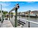 Close up view of a private boat lift at 528 Islebay Dr, Apollo Beach, FL 33572