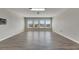 Spacious bonus room featuring wood-look floors and natural light at 528 Islebay Dr, Apollo Beach, FL 33572