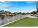 Backyard with artificial turf and canal view at 528 Islebay Dr, Apollo Beach, FL 33572