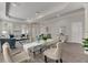 Elegant dining area with glass table and neutral chairs at 528 Islebay Dr, Apollo Beach, FL 33572