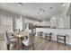 Dining area with light wood table and neutral chairs at 528 Islebay Dr, Apollo Beach, FL 33572