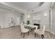 Modern dining room featuring a glass-top table and comfortable seating at 528 Islebay Dr, Apollo Beach, FL 33572