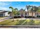 Two-story house with a front porch, attached garage, and palm trees at 528 Islebay Dr, Apollo Beach, FL 33572