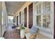 Relaxing front porch with comfortable seating and plants at 528 Islebay Dr, Apollo Beach, FL 33572
