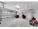 Garage with overhead storage and epoxy flooring at 528 Islebay Dr, Apollo Beach, FL 33572