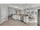 Island kitchen features white cabinets, granite countertops, and stainless steel appliances at 528 Islebay Dr, Apollo Beach, FL 33572