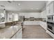 Spacious kitchen with granite countertops, stainless steel appliances, and an eat-in area at 528 Islebay Dr, Apollo Beach, FL 33572