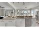 Open kitchen with large island, granite countertops, and stainless steel appliances at 528 Islebay Dr, Apollo Beach, FL 33572