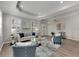 Bright living room features hardwood floors, comfy seating, and large windows at 528 Islebay Dr, Apollo Beach, FL 33572