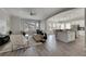 Living room open to kitchen, featuring hardwood floors and modern decor at 528 Islebay Dr, Apollo Beach, FL 33572