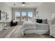 Main bedroom with king bed, large windows, and a seating area at 528 Islebay Dr, Apollo Beach, FL 33572