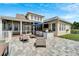 Outdoor kitchen with bar seating and grill, great for summer parties at 528 Islebay Dr, Apollo Beach, FL 33572