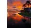 Stunning sunset view over calm lake waters at 528 Islebay Dr, Apollo Beach, FL 33572