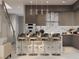 Modern kitchen with marble countertops and three barstools at 5221 29Th S Ave, St Petersburg, FL 33707