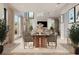 Open concept dining room with a large table and access to the living room at 5221 29Th S Ave, St Petersburg, FL 33707