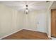 Simple dining area with hardwood floors and modern light fixture at 251 Hidden Brook Dr # 102C, Palm Harbor, FL 34683