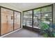Sunroom with sliding glass doors leading to the outdoors at 251 Hidden Brook Dr # 102C, Palm Harbor, FL 34683