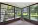Bright sunroom with ample natural light and view of backyard at 251 Hidden Brook Dr # 102C, Palm Harbor, FL 34683