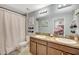 Modern bathroom with double vanity and shower/tub combo at 10820 Carloway Hills Drive, Wimauma, FL 33598