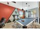 Game room with pool table and geometric wall art at 10820 Carloway Hills Drive, Wimauma, FL 33598