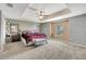 King bedroom with stylish decor and plenty of space at 10820 Carloway Hills Drive, Wimauma, FL 33598