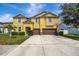 Two-story house with double garage at 10820 Carloway Hills Drive, Wimauma, FL 33598