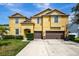 Two-story house with double garage at 10820 Carloway Hills Drive, Wimauma, FL 33598