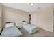 Charming bedroom with two twin beds and a hat organizer at 10820 Carloway Hills Drive, Wimauma, FL 33598