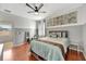 Bright bedroom with a queen bed and access to patio at 10820 Carloway Hills Drive, Wimauma, FL 33598