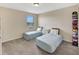 Cozy bedroom with two twin beds and a hat organizer at 10820 Carloway Hills Drive, Wimauma, FL 33598