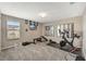 Home gym with stationary bike and weight equipment at 10820 Carloway Hills Drive, Wimauma, FL 33598
