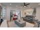 Open living room showcasing a comfortable seating arrangement, a large TV, and an adjoining kitchen at 2860 14Th N Ave, St Petersburg, FL 33713