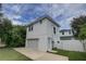 White two-story house with a garage and fenced yard at 2860 14Th N Ave, St Petersburg, FL 33713
