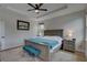 Main bedroom with king-size bed and teal bench at 2860 14Th N Ave, St Petersburg, FL 33713