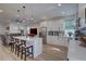 Open concept kitchen with island seating, stainless steel appliances and white shaker cabinets at 2860 14Th N Ave, St Petersburg, FL 33713