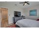 Bedroom with large TV, dresser, and access to hallway at 2860 14Th N Ave, St Petersburg, FL 33713