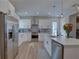 Modern kitchen with stainless steel appliances, white cabinets, and a large island at 2860 14Th N Ave, St Petersburg, FL 33713