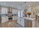 Modern kitchen with white cabinets, stainless steel appliances, and a large island with seating at 2860 14Th N Ave, St Petersburg, FL 33713
