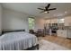 Bedroom with queen bed, kitchenette, and ceiling fan at 2860 14Th N Ave, St Petersburg, FL 33713