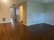 Spacious living room with wood-look floors and an open floor plan at 4315 Aegean Dr # 126C, Tampa, FL 33611