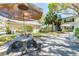 Community patio with seating and umbrella, perfect for relaxing at 4315 Aegean Dr # 126C, Tampa, FL 33611
