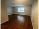 Living room with wood-look floors and a ceiling fan at 4315 Aegean Dr # 126C, Tampa, FL 33611