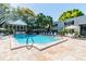 Inviting community pool with plenty of lounge chairs at 4315 Aegean Dr # 126C, Tampa, FL 33611
