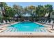 Community pool with lounge chairs and ample surrounding space at 4315 Aegean Dr # 126C, Tampa, FL 33611