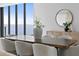Elegant dining room features a large table with seating for eight, offering stunning water views at 2912 W Santiago St # Ph2402, Tampa, FL 33629