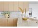 Modern kitchen with marble countertops and gold accents at 2912 W Santiago St # Ph2402, Tampa, FL 33629