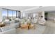 Open concept living room with modern furniture and water views at 2912 W Santiago St # Ph2402, Tampa, FL 33629