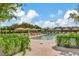 Inviting pool area with lounge chairs and umbrellas at 2912 W Santiago St # Ph2402, Tampa, FL 33629