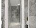 Spa-like bathroom with gray tile, walk-in shower, and glass enclosure at 2912 W Santiago St # Ph2402, Tampa, FL 33629