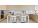 Stylish kitchen with light wood cabinets, marble countertops and island at 2912 W Santiago St # Ph2402, Tampa, FL 33629